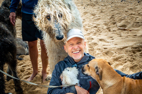 Dr. Peter Dobias on Baby Beach with dogs