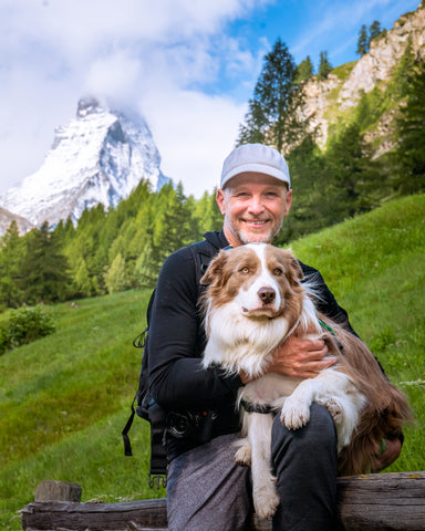 Dr. Peter Dobias and his border collie Pax in the Swiss Alps
