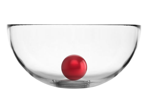 Crystal bowl with red ball sitting inside of it