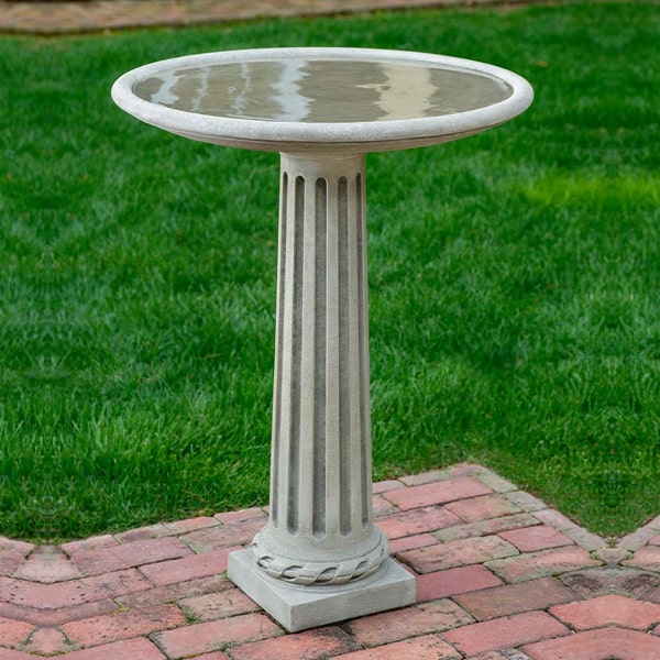 Campania International Empire Birdbath on concrete in the backyard