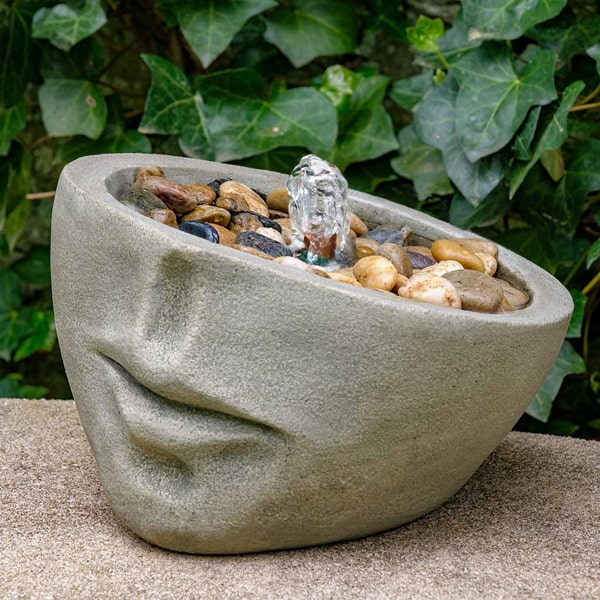 Campania International Faccia Fountain on ledge in the backyard