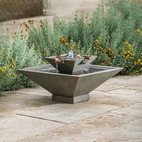 Campania International Facet Fountain, Small on concrete in backyard