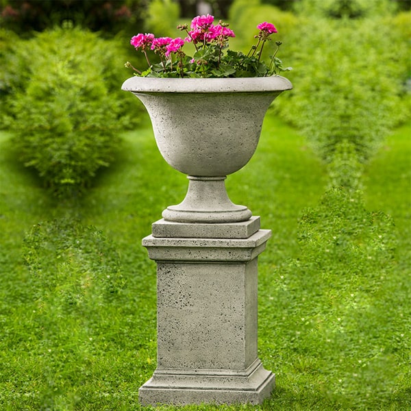 Campania International Greenwich Rustic Pedestal with fairfield urn in the backyard