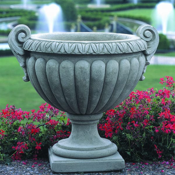 Campania International Longwood Volute Handle Urn on graphite stone against red flowers