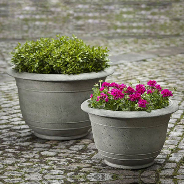 Campania International Padova Planter, Large filled with plants beside a planter filled with flowers