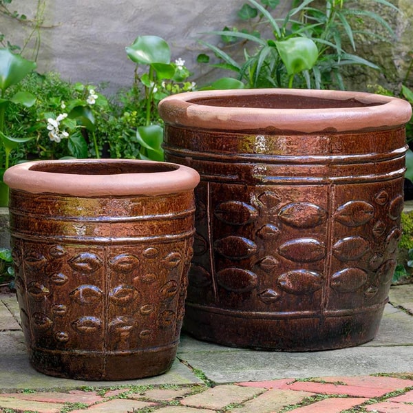 Campania International Rustic Leaf Pot - Rustic Brown - Set of 2 on concrete in the backyard