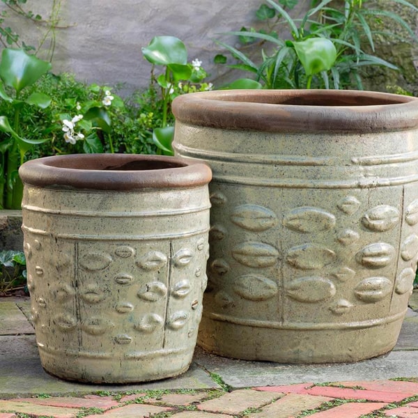 Campania International Rustic Leaf Pot - Rustic Sand - Set of 2 on concrete in the backyard