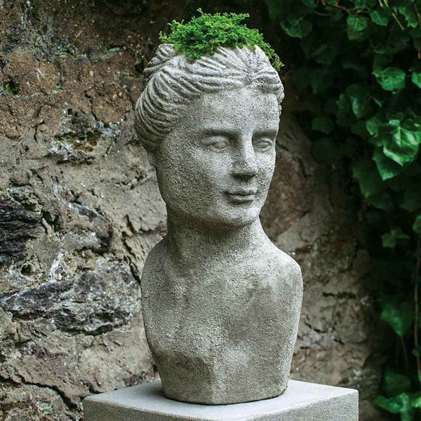 Campania International Venus Planter on concrete filled with plants