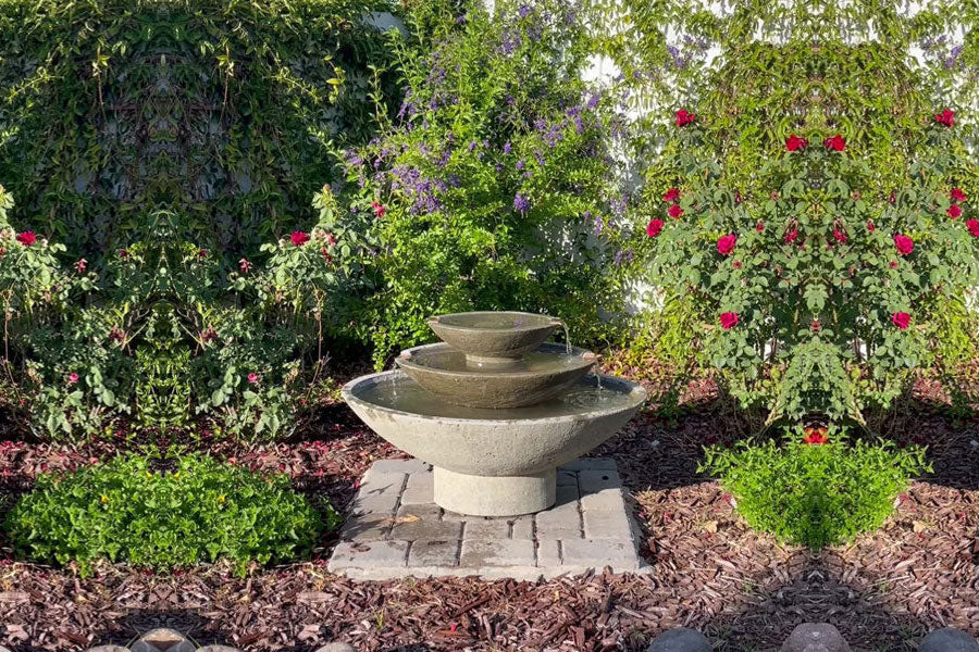 Carrera Oval Fountain in greystone in the backyard