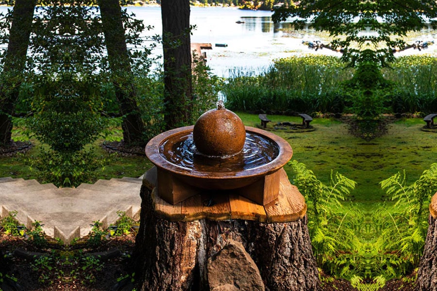 Low Zen Sphere Fountain in Pietra Nuova in the backyard