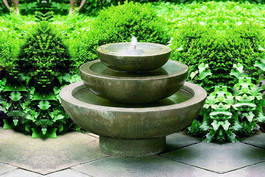 Platia Fountain in aged limestone in the backyard