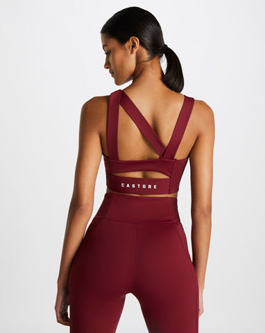 Woman in burgundy gym outfit