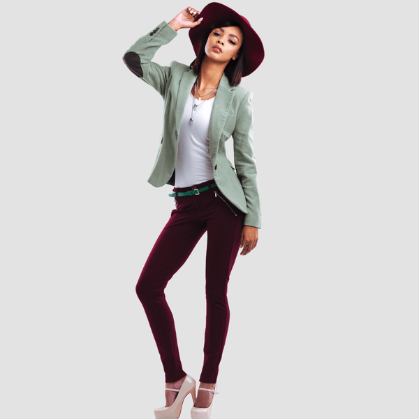 woman wearing a hat, green blazer and wine red pants