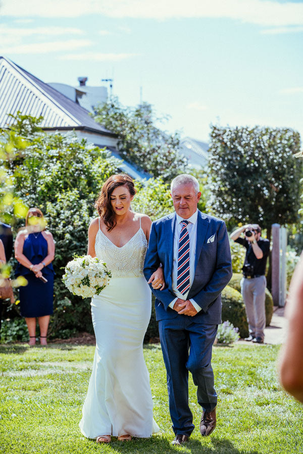 How we styled our wedding using bamboo chairs and market umbrellas for a garden wedding