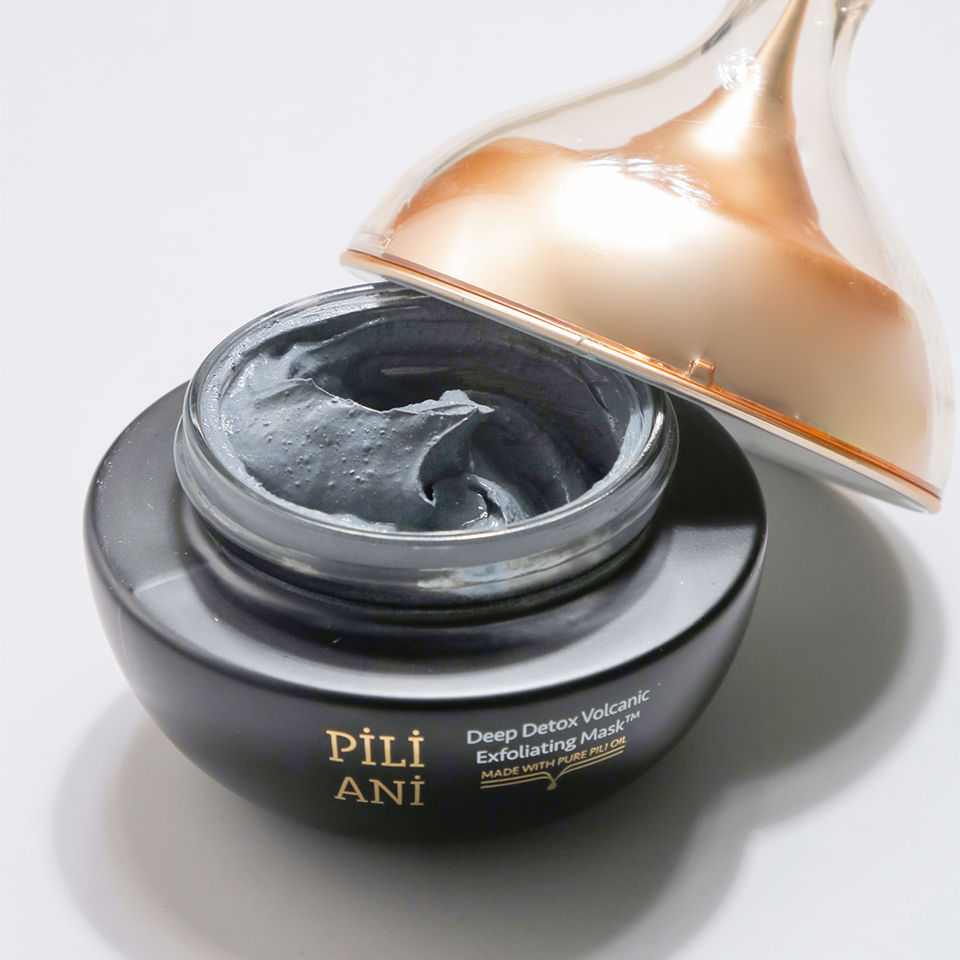 an open pot of Pili Ani's Deep Detox Volcanic Exfoliating Mask