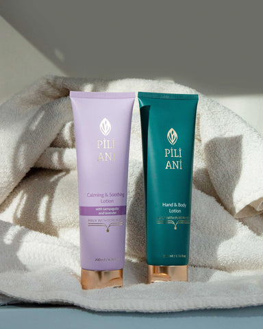 Pili Ani Calming & Soothing Lotion and Classic Lotion on shower towels