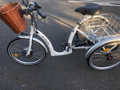white electric trike with basket