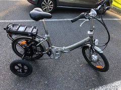 folding grey ebike with stabilisers