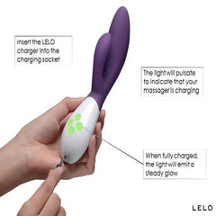 image of a hand holding a lelo ina 3 and pluging a charging cable