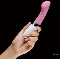 image of a female hand hold a lelo g spot vibrator in pink