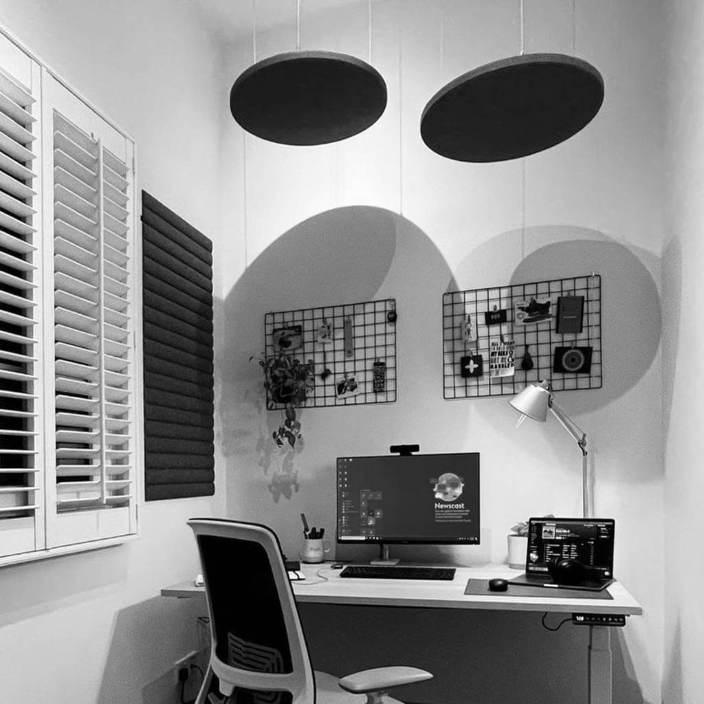 Home office with acoustic felt suspended from the ceiling and on the wall