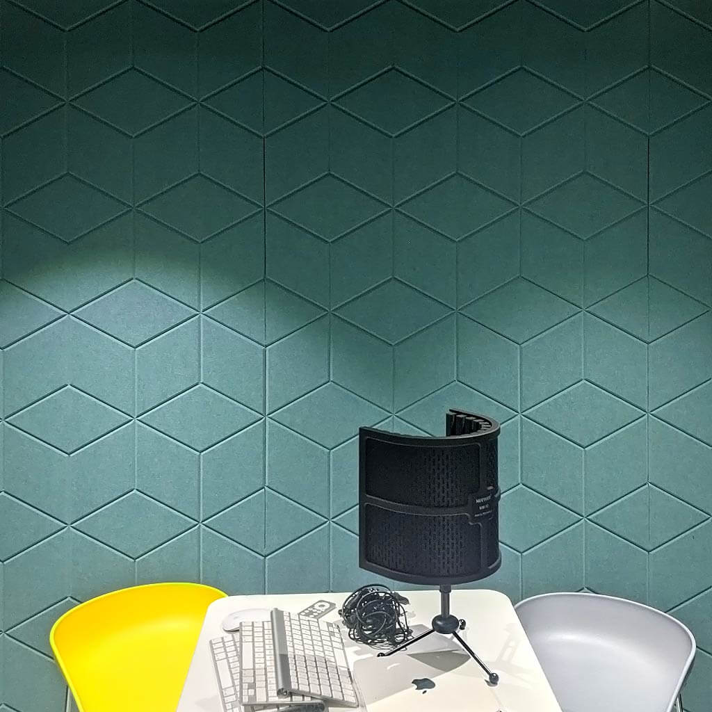 Sound recording studio with green carved felt panels on the wall