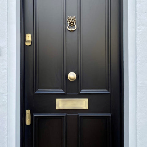 Bespoke front door in high gloss black with Finfort antique brass locks