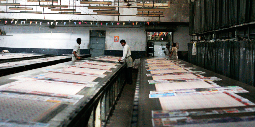 Silkscreen printed scarves waiting to dry on hot wax tables