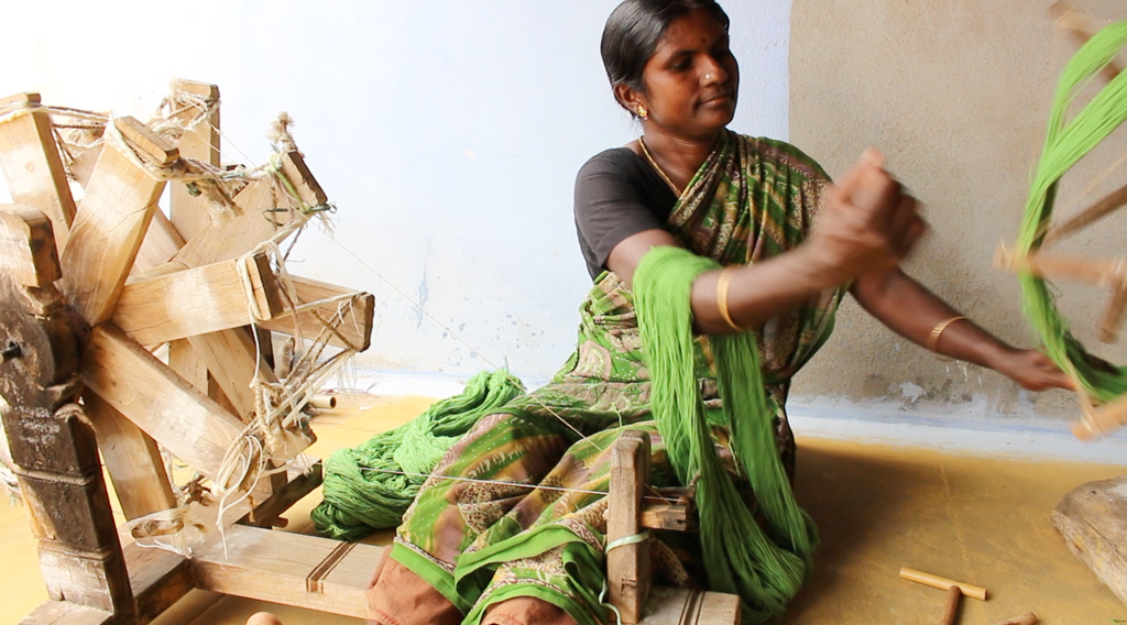 women spinning mysore rug