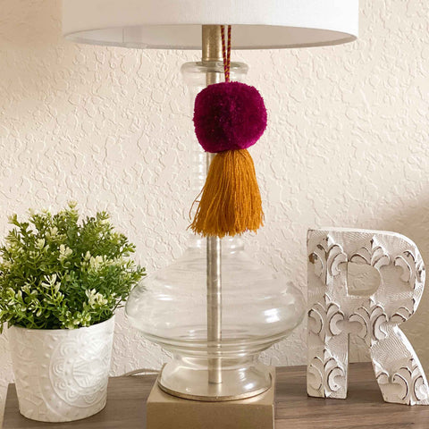 Hanging pom tassel on lamp for decoration