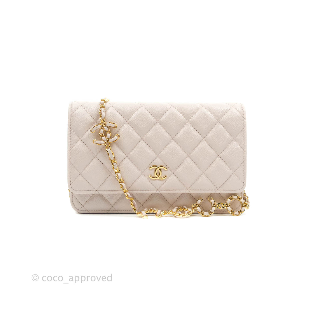 Chanel limited pearls strap WOC in black lambskin with silver hardware.