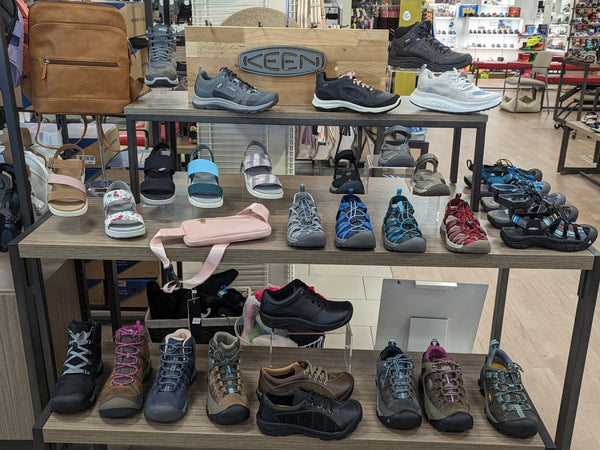 Keen shoes in display with wooden keen logo