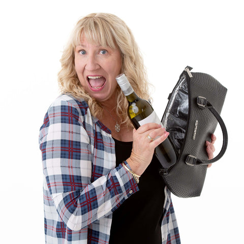 Suzanne Carroll with her wine in a Cool Clutch