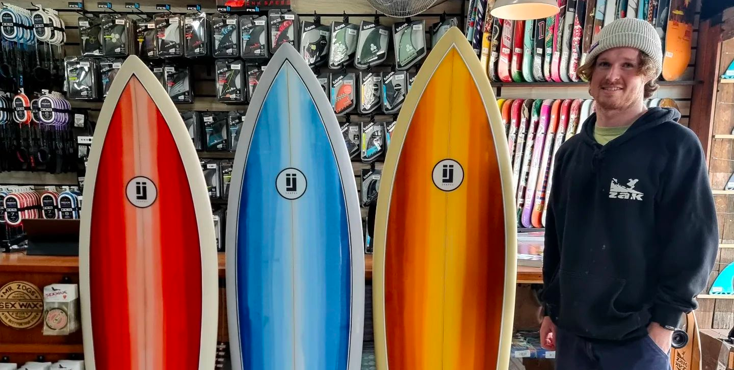 Isaak Jagoe with his display of Fish Surfboards at Melbourne Surfboard Shop