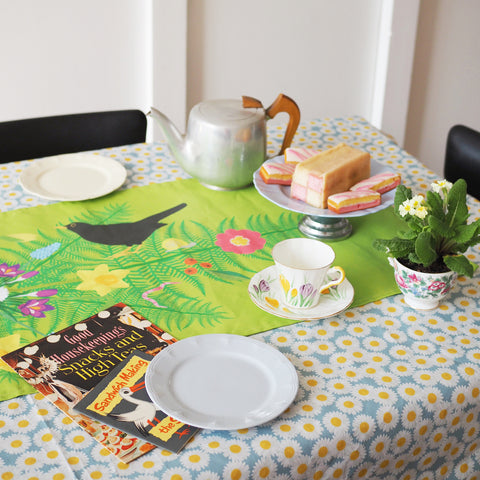 spring-floral-tablecloth-and-green-table-runner-with-teapot-and-cake