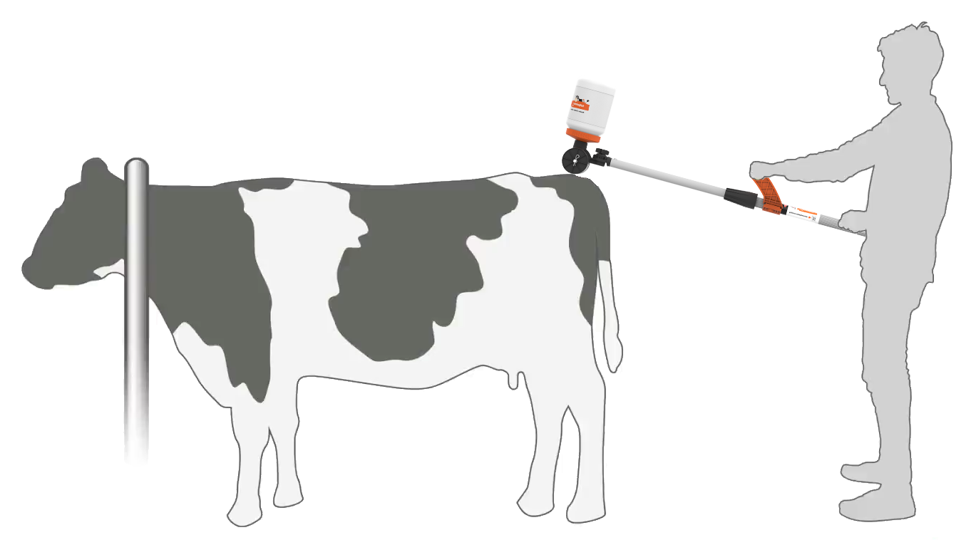 silhouette of a farmer using the Tailpainter in the feed barrier mode