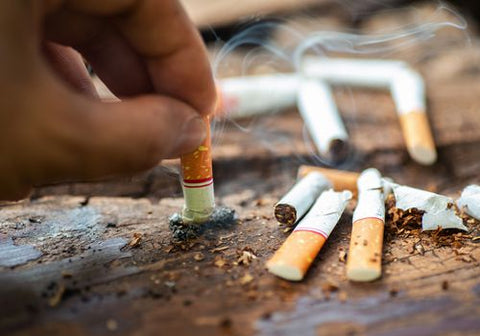 hand putting out a cigarette