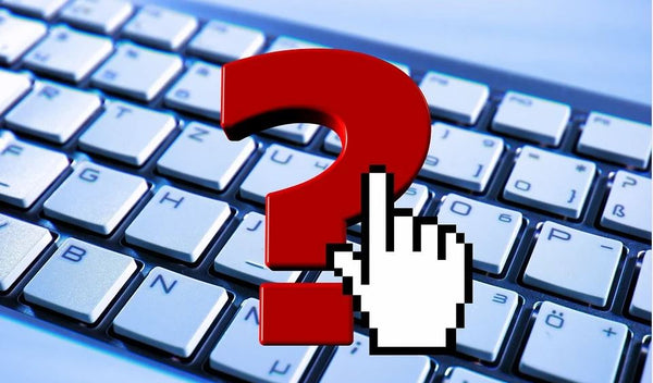 large red question mark super-imposed over computer keyboard