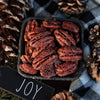 Picture of Fortune Favors candied pecans in a holiday dish, the perfect gift