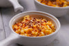 bowl of macaroni and cheese with chopped spicy pecans