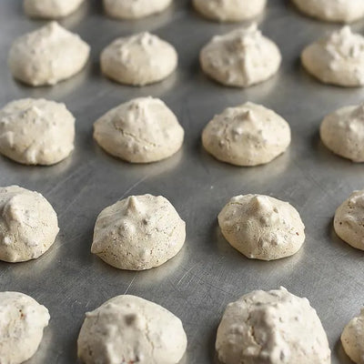 Baking sheet with crispy meringue cookies
