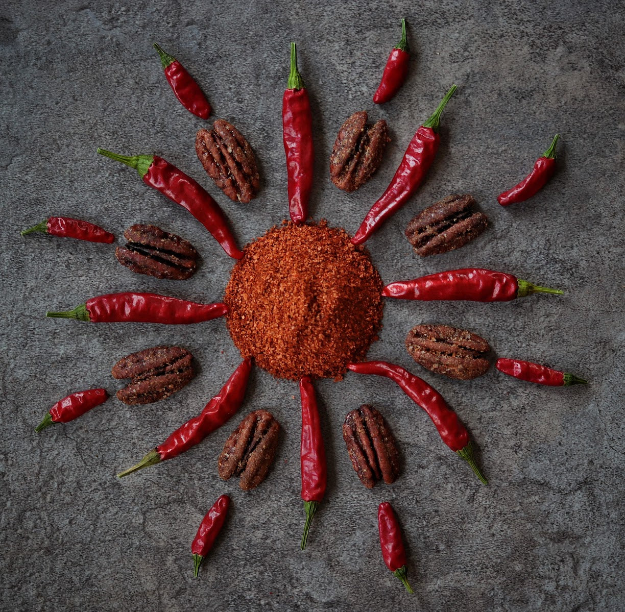 The Spicy pecans arranged with spices and hot peppers