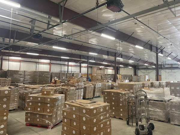 pallets of boxes in a large warehouse