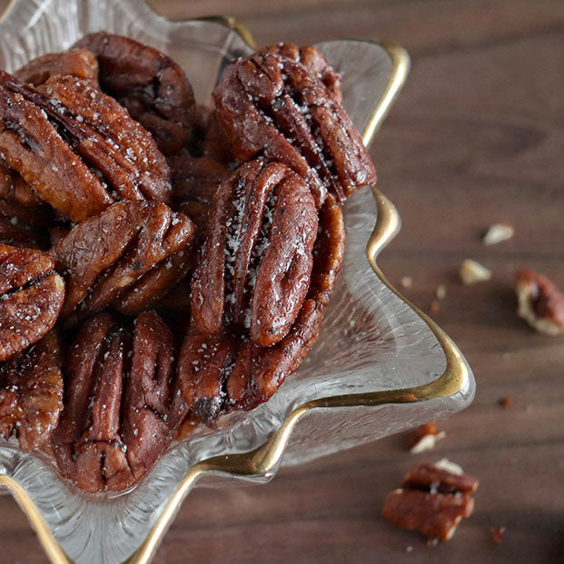New Communities Fortune Favors candied pecans in a dish