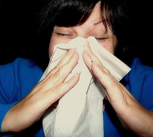 woman sneezing