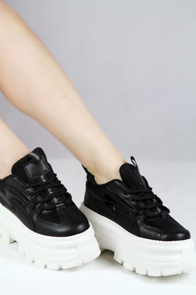 black leather white sole trainers