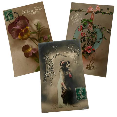 Vintage Christmas postcards of flowers and an old photograph