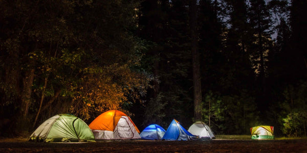 Tents in the night with lights - Defiance Gear