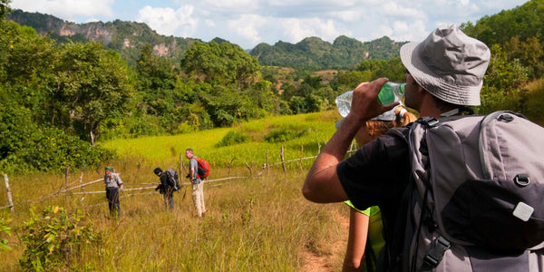 Drinking from Water bottle on the hiking trail - Defiance Gear