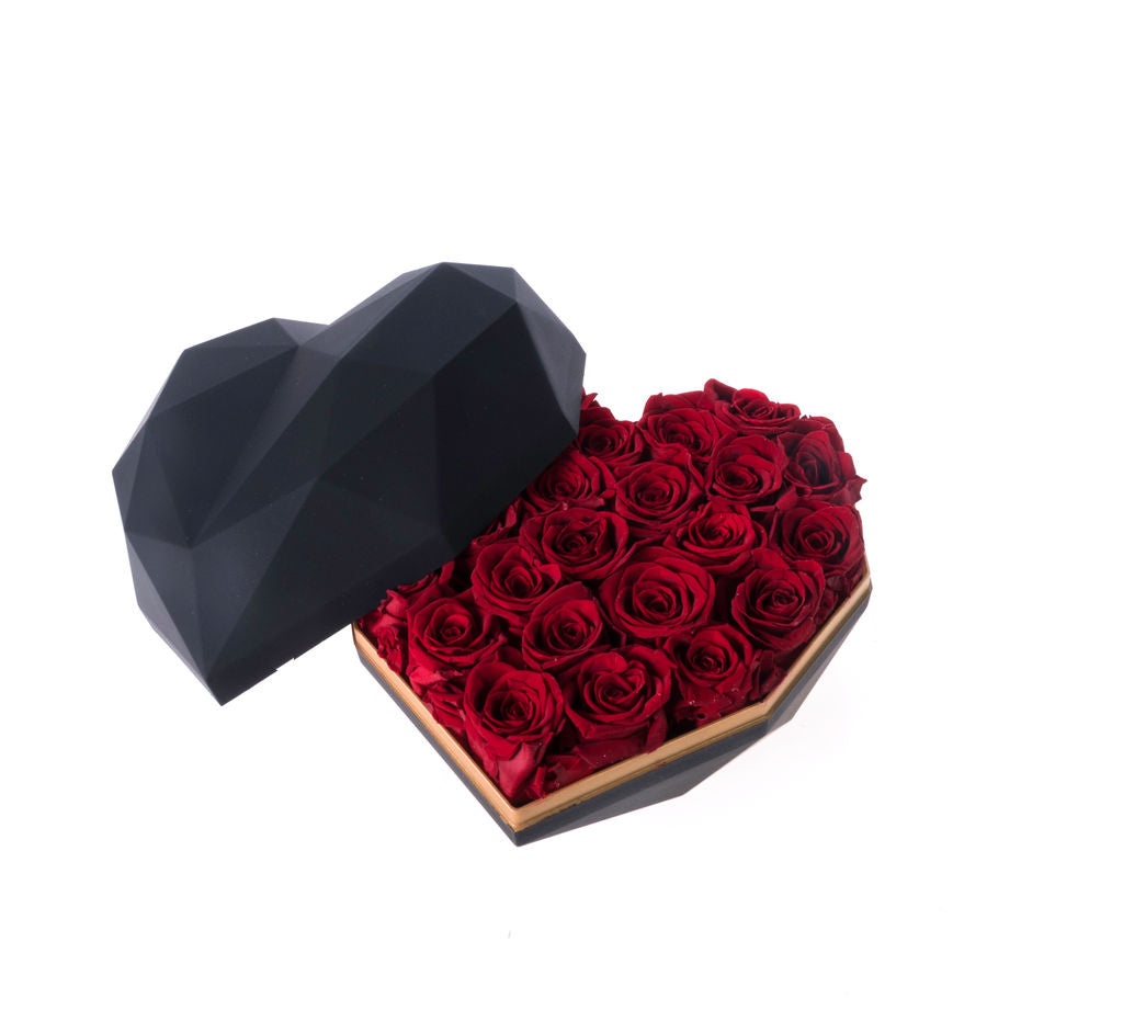 Luxurious pink and red roses in heart shaped box